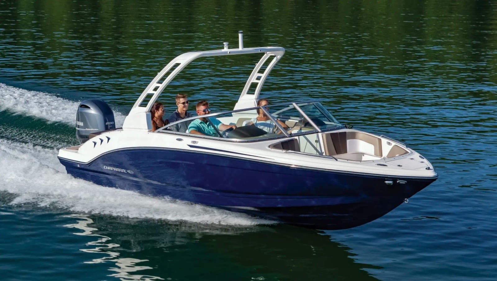 Chaparral ski boat rental carrying passengers across Lake Norman